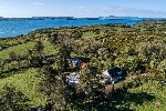 Aerial Overview of Property and Sea Views.