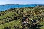 Aerial Overview of Property and Sea Views.
