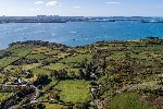 Aerial Overview of Property and Sea Views.