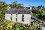 Aerial Overview of Property and Sea Views.